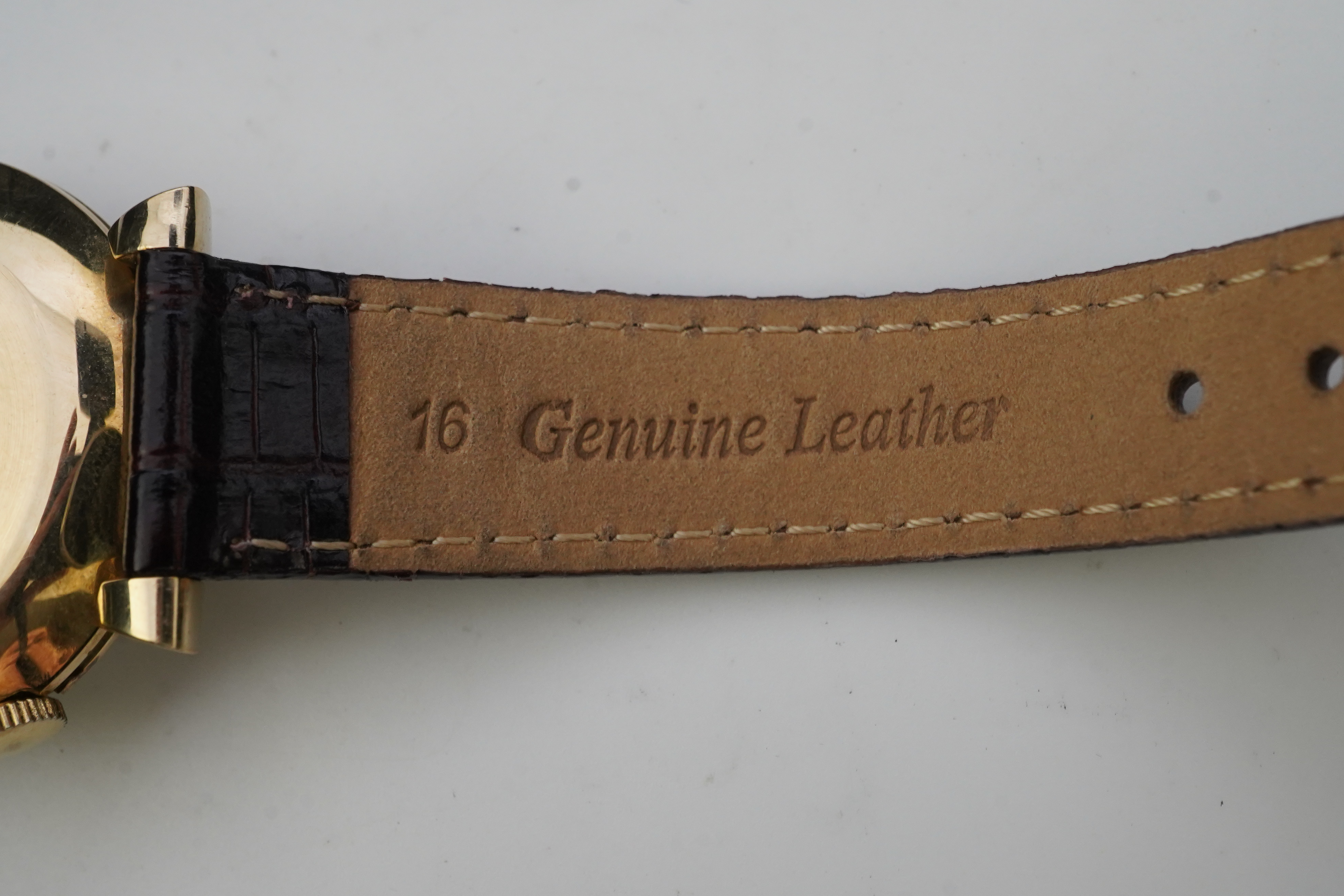 A gentleman's 1950's gold plated Jaeger LeCoultre Memovox manual wind wrist watch, on a later associated leather strap